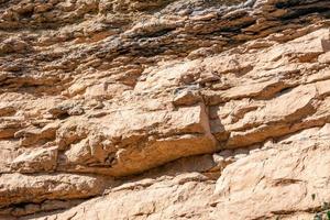 stone wall background in the sun photo