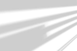 Abstract shadow and striped diagonal light background on white wall from window, architecture dark gray and sunshine diagonal geometric effect overlay for backdrop and mockup design. photo