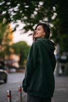 Portrait of cute girl with long hair looks at the camera photo