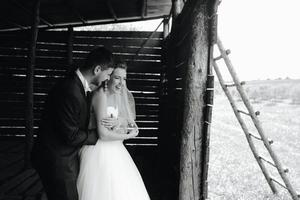 Photo of beautiful couple on nature in wooden hut