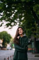 Portrait of cute girl with long hair looks at the camera photo