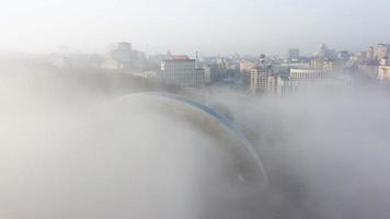 Aerial view of the city in the fog. photo