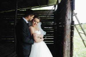 Photo of beautiful couple on nature in wooden hut