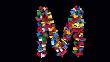 briques colorées mélangées blocs de construction police de caractères texte animation m video