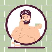 Skincare routine concept. Close up mirror reflection happy young man applying face moisturizing cream or lotion on cheek, handsome bearded male enjoying skincare procedure. vector