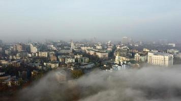 Aerial view of the city in the fog. photo