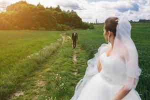 Beautiful wedding couple on nature photo