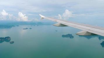 Aerial view over group of island in Andaman sea near Phuket, southern part of Thailand, view from descending airplane video