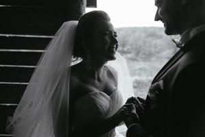 Photo of beautiful couple on nature in wooden hut