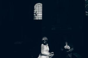 bride and groom illuminated by light photo