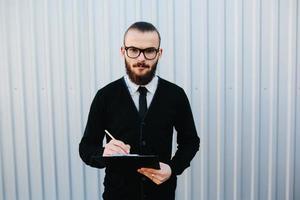 businessman signs a document photo