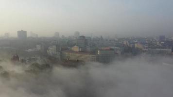 Aerial view of the city in the fog. photo