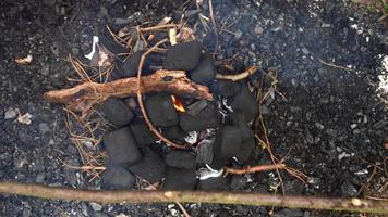 Man making a fire in the forest photo