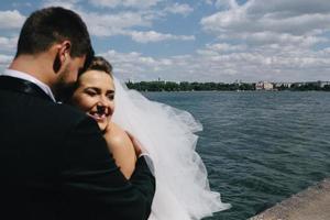 couple on blue sky background, water photo