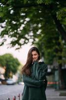 Portrait of cute girl with long hair looks at the camera photo