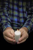 Hands and candle photo