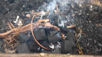 Man making a fire in the forest photo