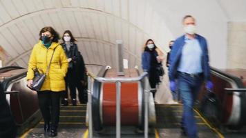 UKRAINE, KIEV - MAY 26, 2020 subway station. People go on the escalator in the metro. photo