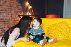 Mother and little son play at home photo