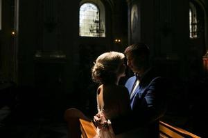 bride and groom illuminated by light photo
