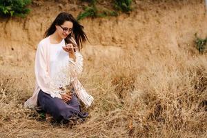 Young pretty girl posing on camera and enjoying summer day. photo