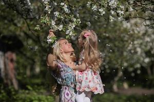 mother and daughter in the garden photo