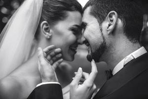 beautiful bride caress gently, the groom's face photo