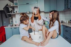 Happy family cook together in the kitchen photo