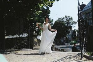 Bride posing in city photo