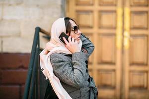 girl in a coat on the street photo