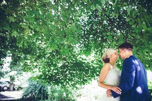 bride and groom dancing in nature photo