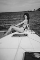 Fashion outdoor photo of beautiful young woman posing on a yachts