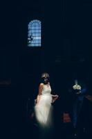 bride and groom illuminated by light photo