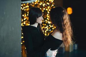 Two girls in each other's tender embraces photo