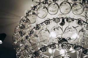 Beautiful chandelier made with glasses of wine photo