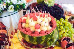 Cocktail with fruits, grapefruit, grapes, apple, pomegranate, watermelon photo
