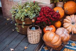 Autumn decoration with pumpkins and flowers on a street in a European city photo