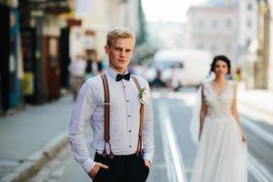 bride and groom on the street photo