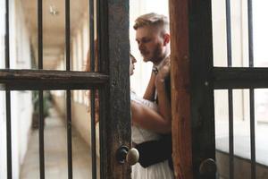 Groom and gorgeous brine in hotel room photo