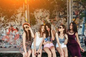 Five beautiful young girls relaxing photo