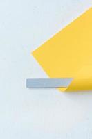 gray nail file wrapped in yellow paper photo