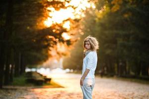 beautiful girl in sunset light photo