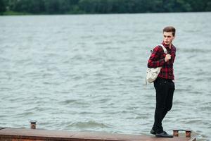 man standing on a pier photo