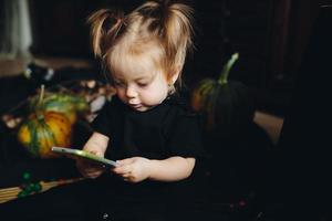 little girl playing in a witch photo