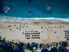 Beach with sun loungers on the coast of the ocean photo