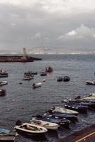 Berth with boats on sea shore photo