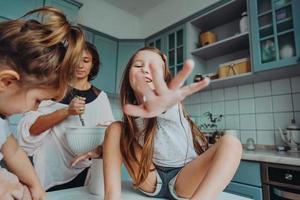 Happy family cook together in the kitchen photo