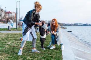 Two women and a little boy on the lake photo