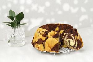 Traditional Homemade Marble Cake. Sliced Marble Bundt Cake on White Wire Rack photo