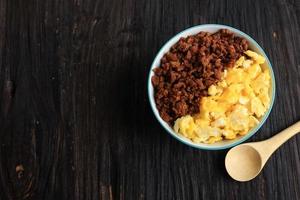 Top View Tori Soboro Don, Japanese Rice Bowl Menu with Stir Fry Beef or Chicken Soy Sauce and Scrambled Egg photo